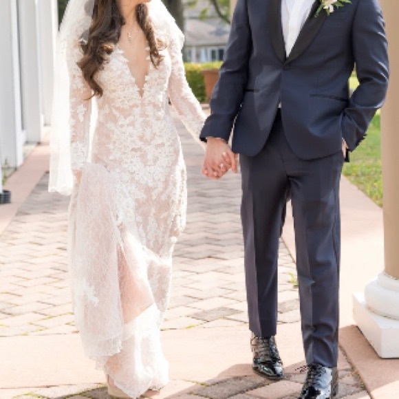 Petite long sleeve plunging v-neckline ivory lace wedding gown